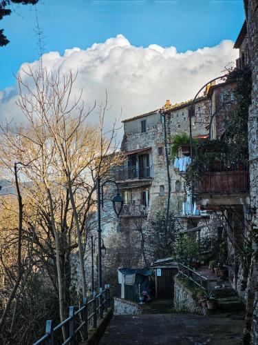 an old stone building with balconies on the side of it at La dolce vita Giove apartment in Giove