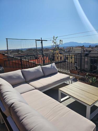 a couch sitting on top of a balcony at La dolce vita Giove apartment in Giove
