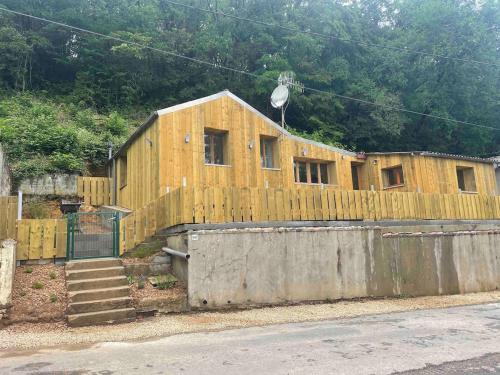 a house being constructed on the side of a street at La Capiniella in La Chapelle-Moulière