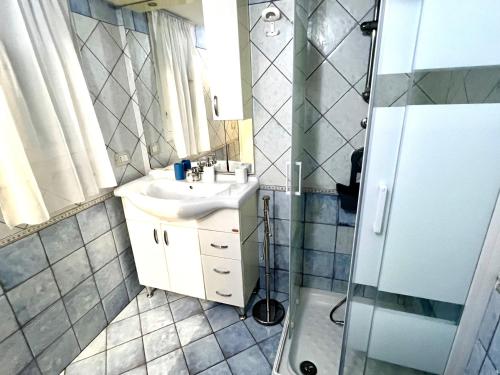 a bathroom with a sink and a shower at Trapani Centro Mare in Trapani
