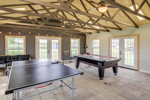 a large room with a ping pong table in it at Dry Ridge Rental Home with Hot Tub and Game Room! in Dry Ridge