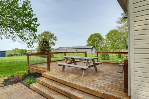 a wooden deck with a picnic table on it at Dry Ridge Rental Home with Hot Tub and Game Room! in Dry Ridge