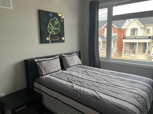 a bedroom with a bed and a window at 4 Bedroom Pickering house in Pickering