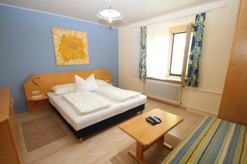 מיטה או מיטות בחדר ב-Gästehaus Dobida