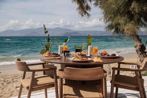 a table on the beach with food on it at Agia Anna Living in Agia Anna Naxos