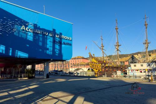 a view of a harbor with a boat in the water at Green Apartment - Airport 8 min - AC - Smart TV in Genova