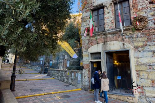 two people are standing outside of a building at Green Apartment - Airport 8 min - AC - Smart TV in Genova