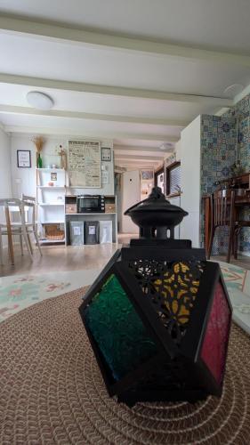 a glass object sitting on the floor in a living room at Domček na samote in Nové Mesto nad Váhom