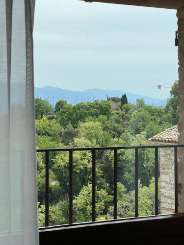 a window with a view of a mountain at San Gemini Palace in San Gemini