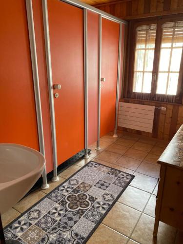 a bathroom with a tub and a shower stall at Séjour Edelweiss in Arolla