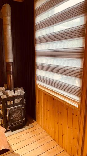 a window in a room with a wooden floor at Akhalsheni House in Batumi