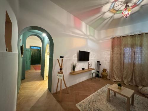 a living room with a tv on a ceiling at Big Apartment in Central Medina 3BR ,view and Jacuzzi Tetouan in Tetouan