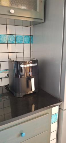 a kitchen with a coffee pot on a counter at Casa Luca ai Borghi di Villasimius in Villasimius