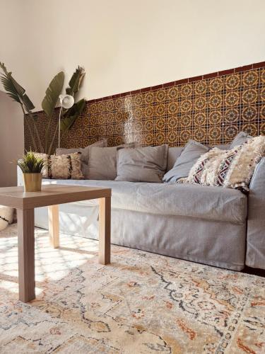 a living room with a couch and a coffee table at Big Apartment in Central Medina 3BR ,view and Jacuzzi Tetouan in Tetouan