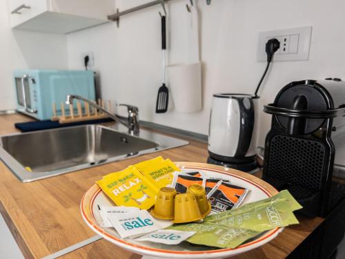 a plate of food on a counter in a kitchen at Green Apartment - Airport 8 min - AC - Smart TV in Genova