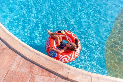 a woman laying on at Pickalbatros Palais Des Roses - Agadir - All Inclusive in Agadir