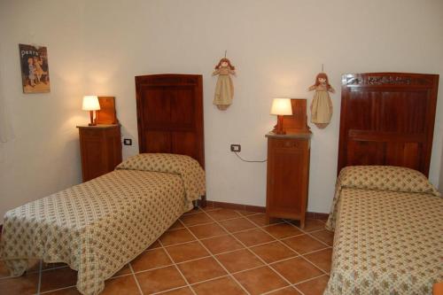 Ένα ή περισσότερα κρεβάτια σε δωμάτιο στο Rustico in campagna a pochi minuti dal mare