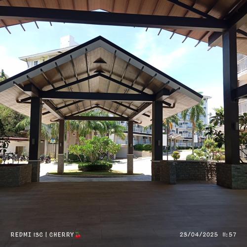a large pavilion in a parking lot at Amani Luxe Free Pool and Gym access in Lapu Lapu City