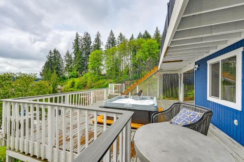 a balcony with a hot tub and a table and chairs at Lakeside Lacey Gem with Sauna and Private Dock in Lacey
