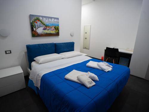 Postel nebo postele na pokoji v ubytování Amuri Room&Suite