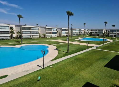 an image of an apartment complex with two pools at Ola blanca 1 enjoy in Sidi Rahal