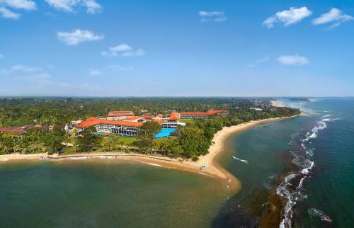 an aerial view of a resort on a beach at Cinnamon Bey Beruwala in Bentota