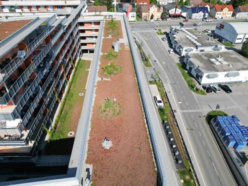an aerial view of a city street with a building at 100 qm Penthouse, Self-Check-In, 2 Parkplätze in Graz