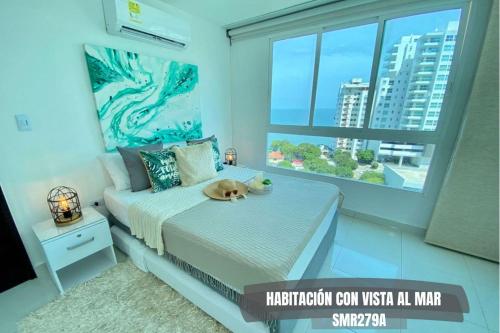 a bedroom with a bed with a dog laying on it at Apartamentos Neos - Cerca al Mar by SOHO in Santa Marta