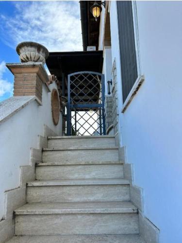 a set of stairs leading up to a building at Oasi di Mare next Rome Airport in Fregene