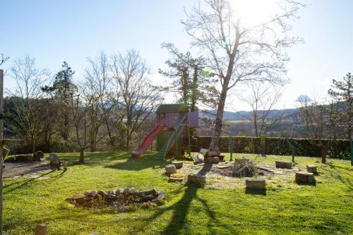 a park with a playground with a slide at Farm stay Synergia - Hiden treasure in Pazin