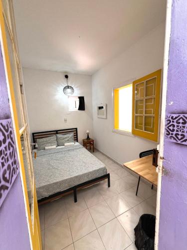 a bedroom with a bed and a window at RIA Terrace in Faro