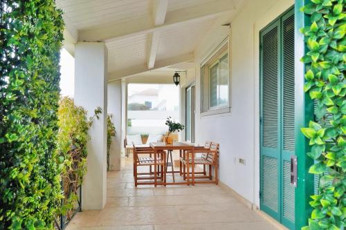 an outdoor patio with a table and chairs at Mbird Estoril Riviera Flat 3 in Estoril