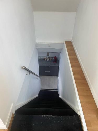 a staircase in a room with a sink in the middle at Beautiful apartment F4 Suite Manon in Joeuf