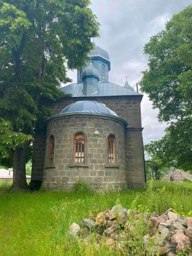 a stone building with a dome on top of it at Еко дом с верандой с видом на горы in Borjomi