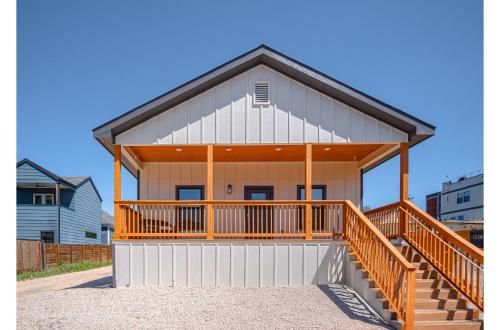 a large house with a large deck on a house at 3BR-2BA Cityscape Haven with Panoramic Tower View in San Antonio