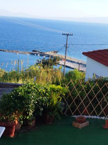 a view of the ocean from a house at Mare Mia in Loutraki