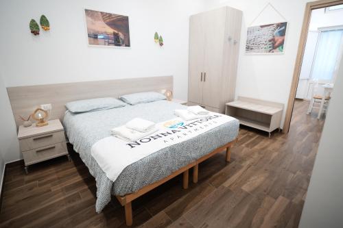 Postel nebo postele na pokoji v ubytování Nonna Vittoria Apartments