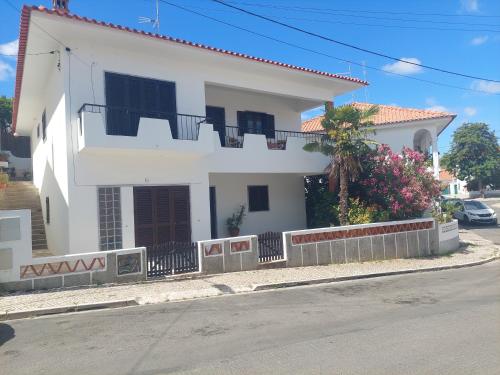 a white house on the side of a street at CASA Eleven in Mértola