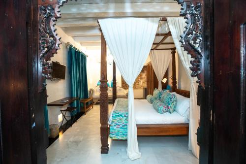 Кровать или кровати в номере Hotel Aguamarina Boutique