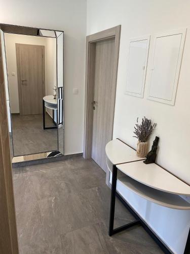 a bathroom with a sink and a mirror at Villa Fidelissima in Kaštela