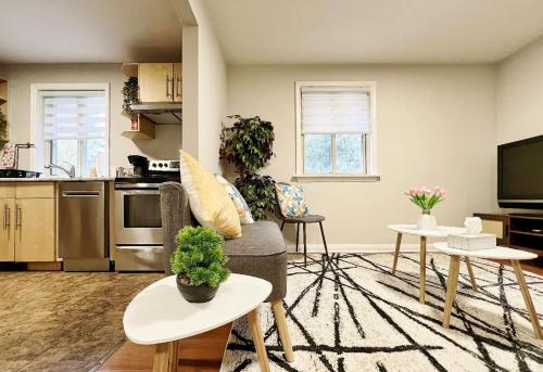 a living room with a couch and a kitchen at Homestay At Major Mackenzie Drive-CENTRAL LOCATION-WALKING PLAZA in Richmond Hill
