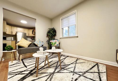 a living room with a couch and a table at Homestay At Major Mackenzie Drive-CENTRAL LOCATION-WALKING PLAZA in Richmond Hill