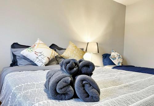 a bedroom with a bed with towels on it at Homestay At Major Mackenzie Drive-CENTRAL LOCATION-WALKING PLAZA in Richmond Hill