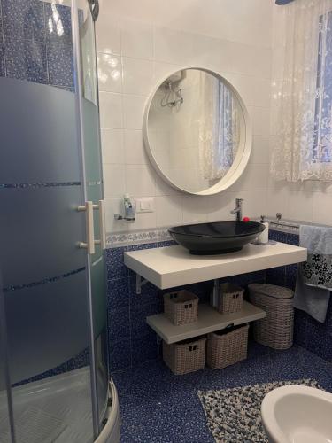 a bathroom with a sink and a mirror at Terrazza Merope in Torre dell'Orso