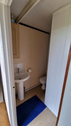 a small bathroom with a sink and a toilet at Escape and Relax on the Beautiful Coast North Norfolk in Fakenham