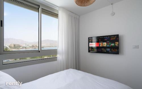 Postel nebo postele na pokoji v ubytování Luxury Apartments And Studios At Sea Side By Rently