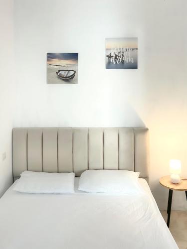 Postel nebo postele na pokoji v ubytování E Apartment