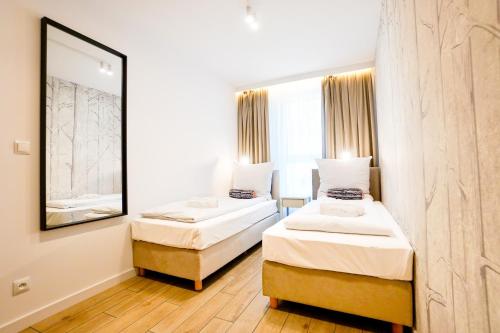 Postel nebo postele na pokoji v ubytování Park View Residence by Baltic Home