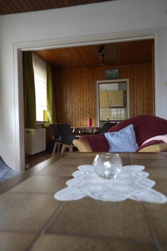 a glass bowl on a table in a room at Ferienhaus Hanna in Apen