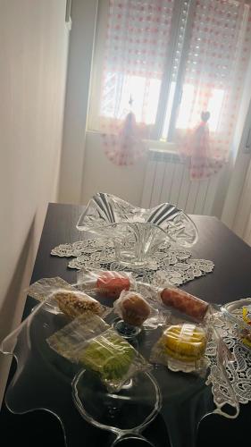 a table with plates of food on top of it at Gevihome in Capua